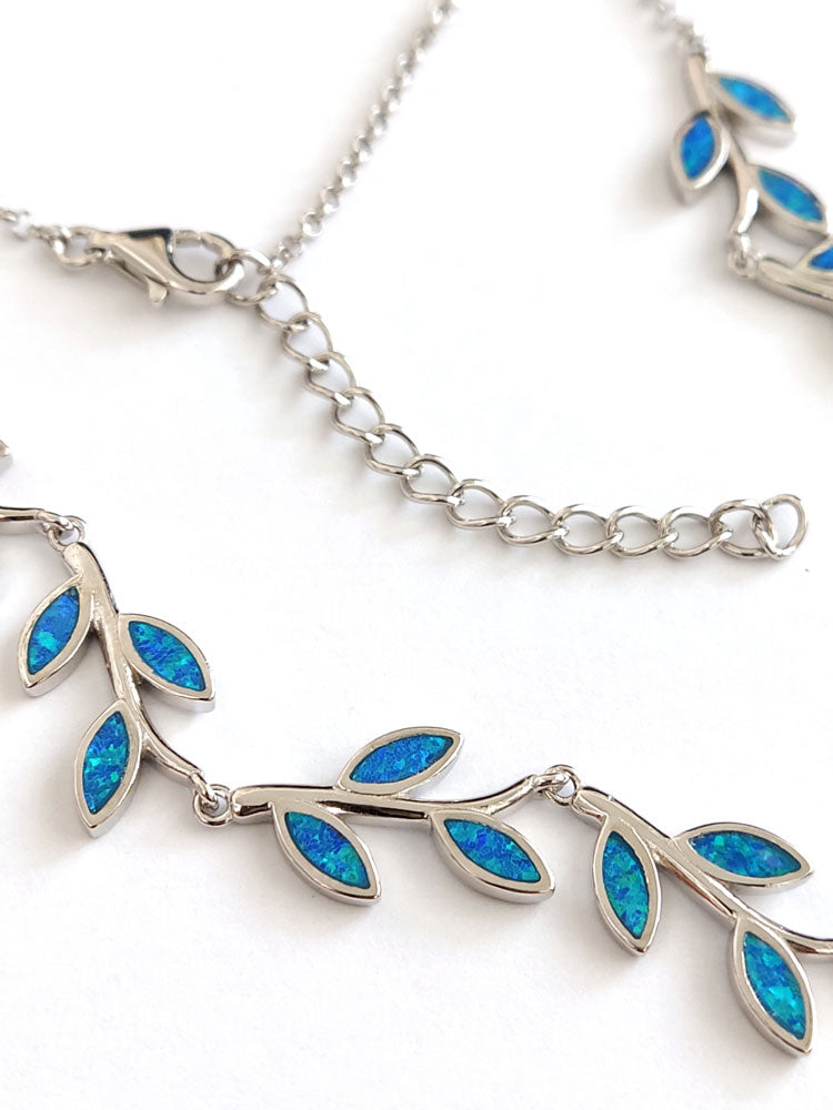 Close-up of sterling silver 925 leaves necklace with blue opal stones made in Greece