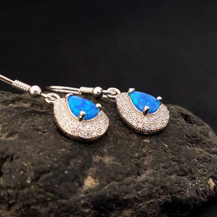 Close-up of Blue Opal and Cubic Zirconia Dangle Earrings with hallmark 925