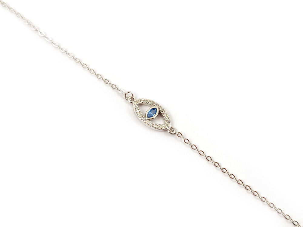 Close-up of sterling silver evil eye bracelet with blue zirconia