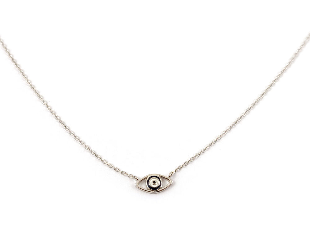 Close-up of a handmade Greek Evil Eye necklace showcasing a vibrant enamel charm on a sterling silver chain, symbolizing protection and good luck.
