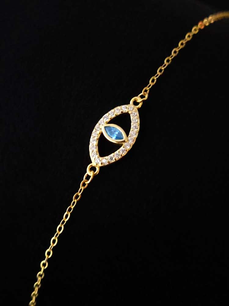 Elegant gold-plated sterling silver bracelet featuring protective Evil Eye symbol, white & aqua crystals