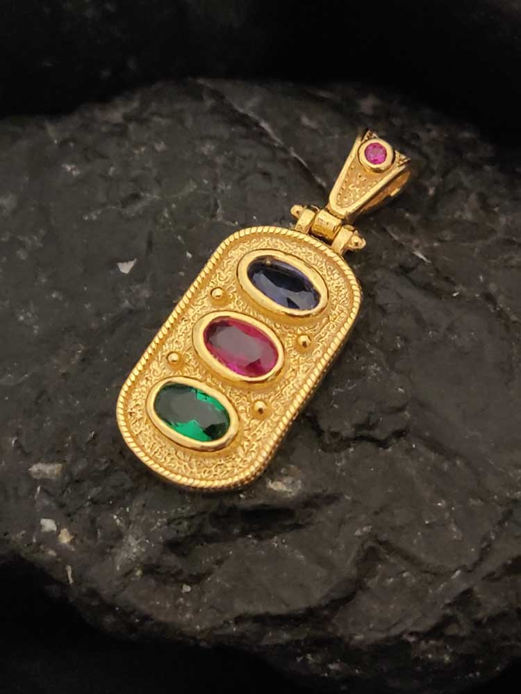 "Gold-plated Greek Byzantine pendant featuring colorful red, green, and dark blue cubic zirconia stones."