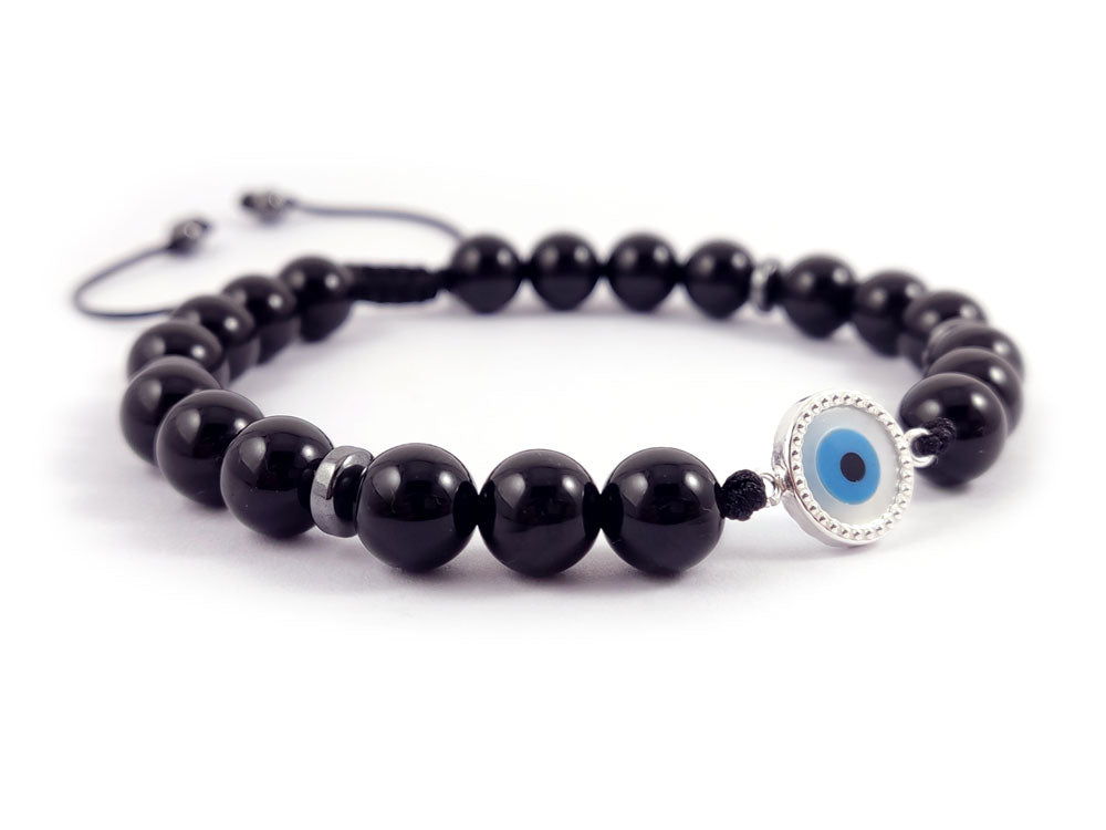 "Stylish bracelet featuring a Sterling Silver 925 Mother of Pearl Evil Eye charm (10mm) and 8mm onyx black stones. Includes a slide clasp, hallmark 925, crafted in Greece with free shipping offered globally."