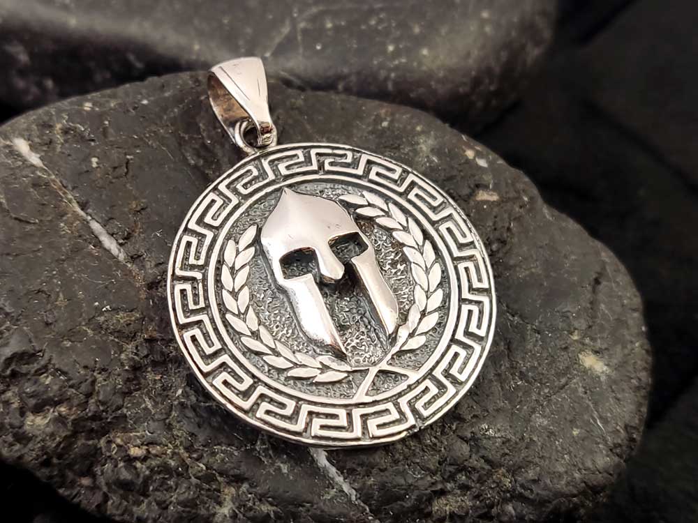 Handmade Greek Spartan Helmet Pendant – 25mm – A side-angle shot highlighting the intricate craftsmanship and hallmark 925 stamp.