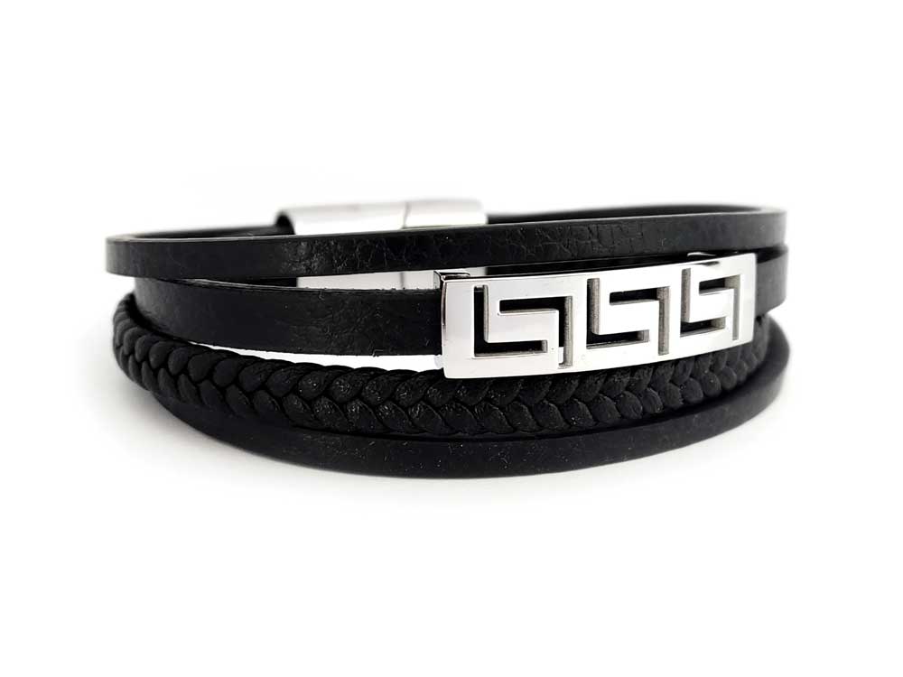Close-up of hallmarked stainless steel Greek key detail on black leather bracelet