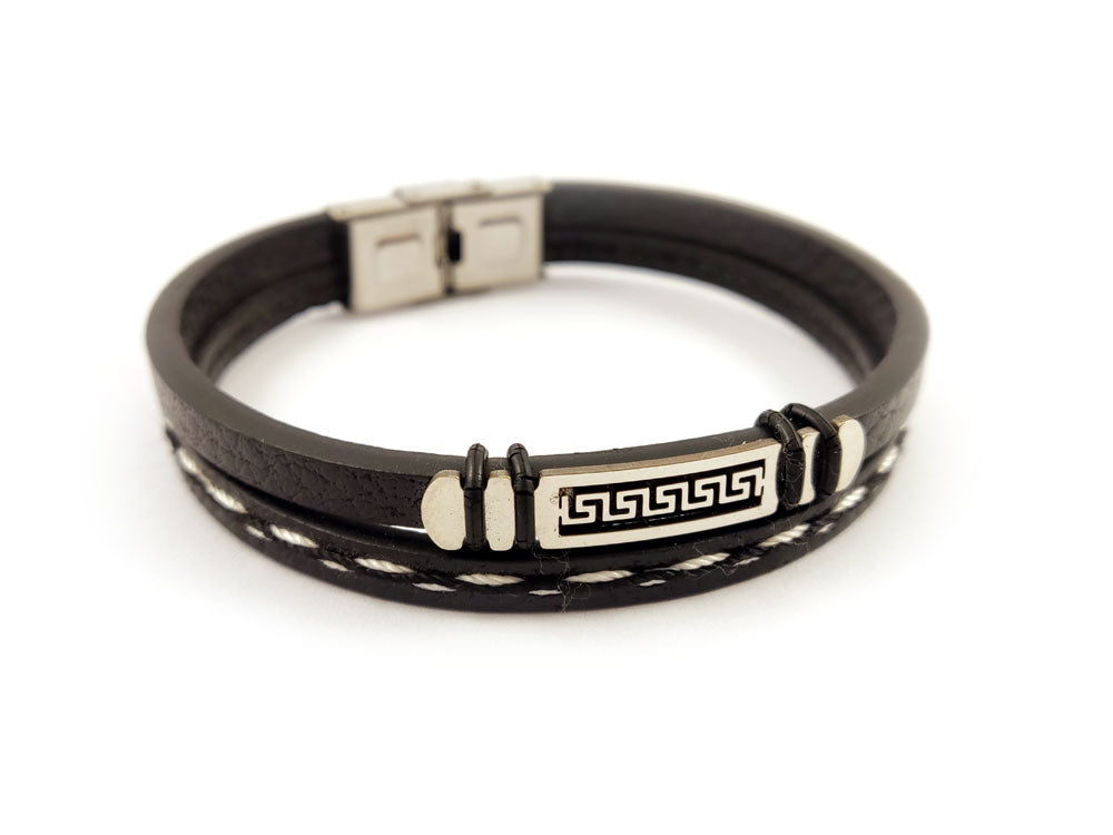 Black leather and silver stainless steel men's bracelet close-up