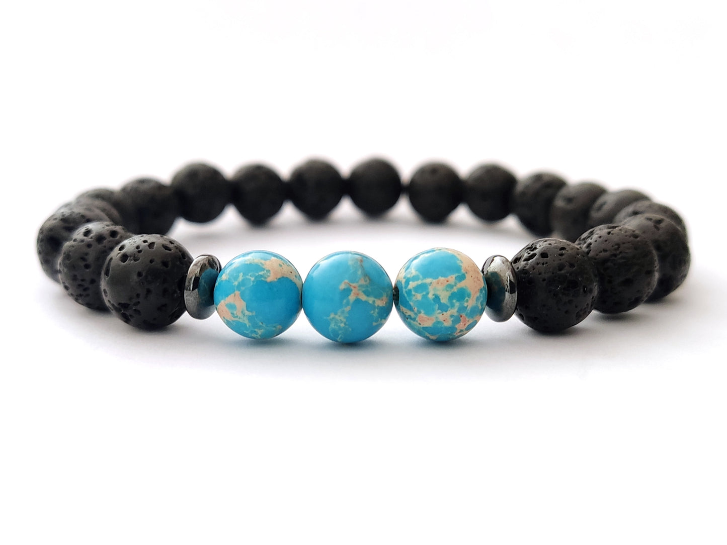 Greek volcanic lava stones and blue agate stones bracelet measuring 8mm on white background.