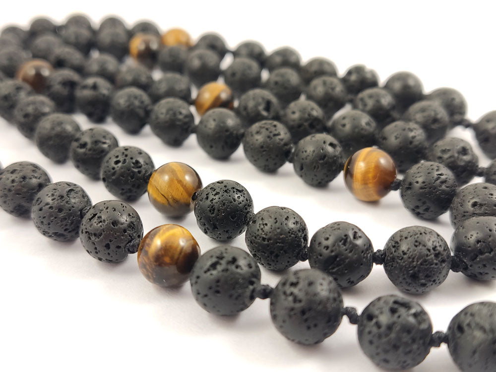 Handmade Lava Stone and Tiger’s Eye necklace with a striking stainless steel dragon charm centerpiece.