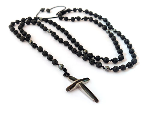 Elevate your style and spirituality with our Handmade Rosary Necklace. Meticulously crafted in Greece, it boasts Natural Black Lava and Hematite Stones (4mm) for a touch of nature's elegance. The Stainless Steel Cross (30 x 20 mm) adds a meaningful symbol, while the adjustable length ensures a comfortable fit between 55 - 70 cm. Embrace the artistry of Greece and enjoy Free Shipping on this exquisite piece.