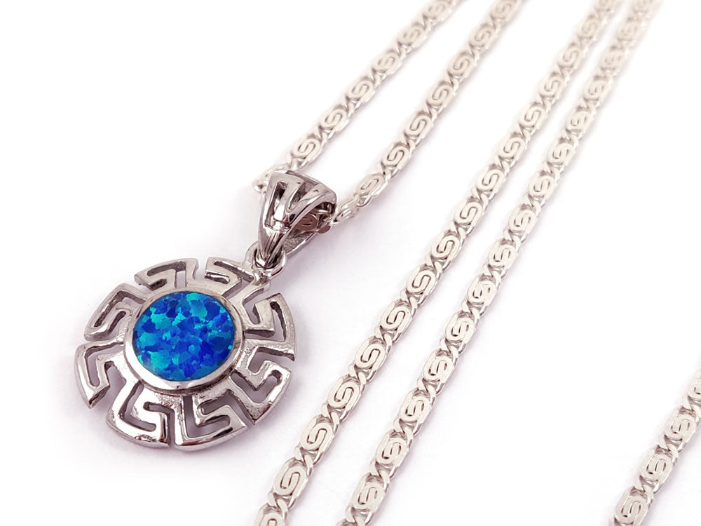 Close-up of blue opal stone set in a sterling silver Greek infinity pendant, measuring 17 mm.