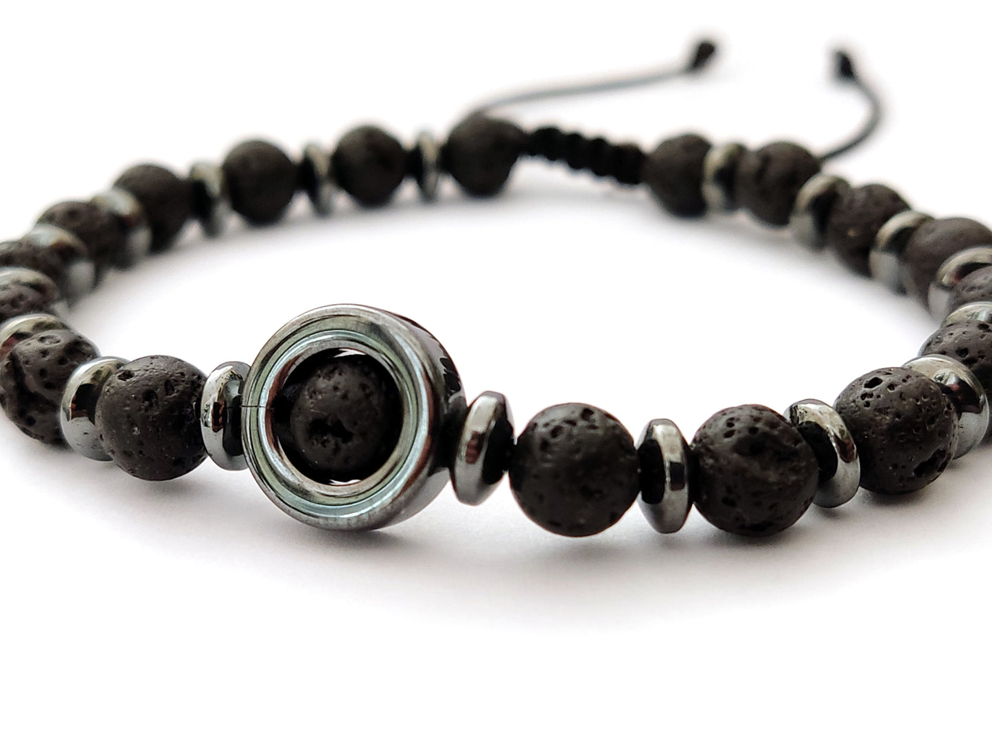 Greek bracelet made of black volcanic and gray hematite stones measuring 6mm width on white background.