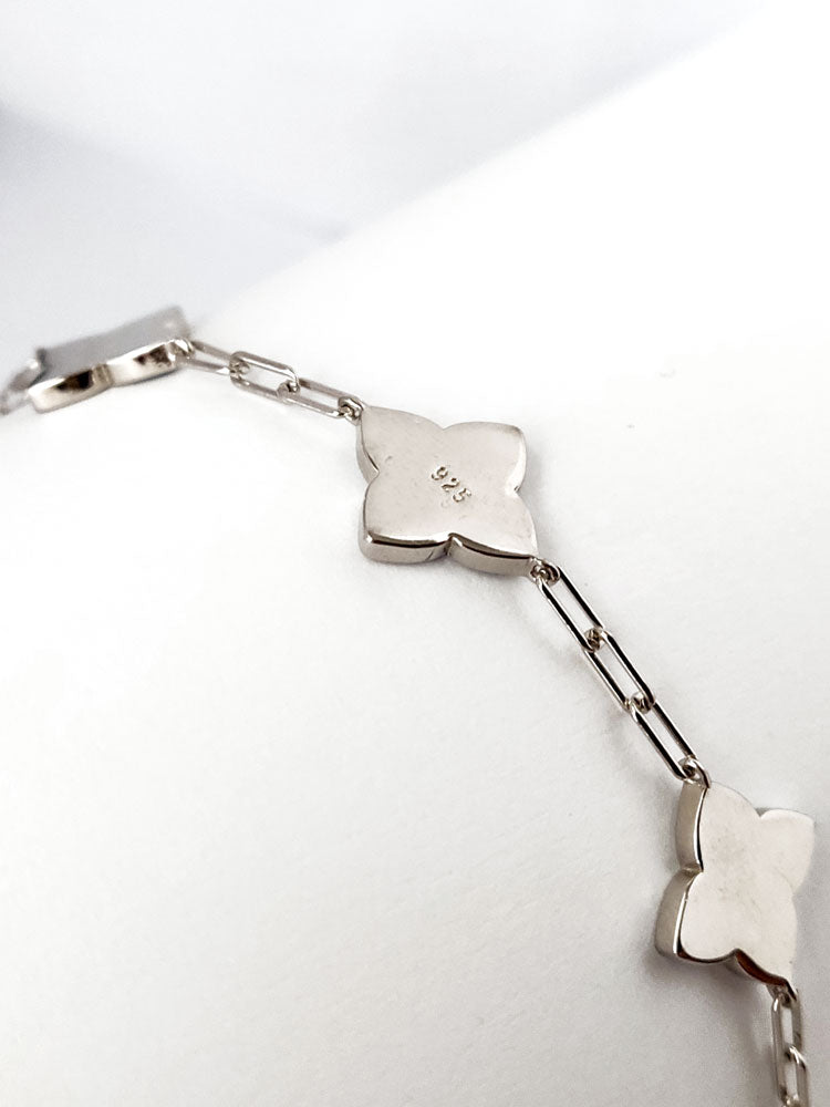 Backview of a silver bracelet showing the 925 hallmark of authenticity.