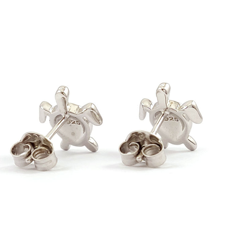Pair of silver turtle stud earrings on a white background