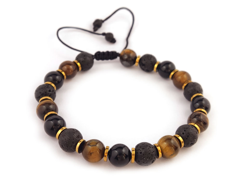 Flat Lay of Sirioti Jewelry Bracelet: A stylish arrangement of the lava, tiger's eye, onyx, and gold-colored hematite bracelet, emphasizing its natural stones and luxurious craftsmanship.