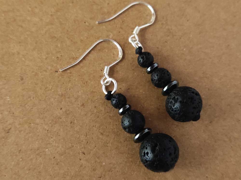 "Close-up of natural volcanic lava stone earrings with sterling silver 925 hooks, showcasing 10mm (0.39”), 6mm (0.24”), and 4mm (0.16”) stones for a bold, earthy look."