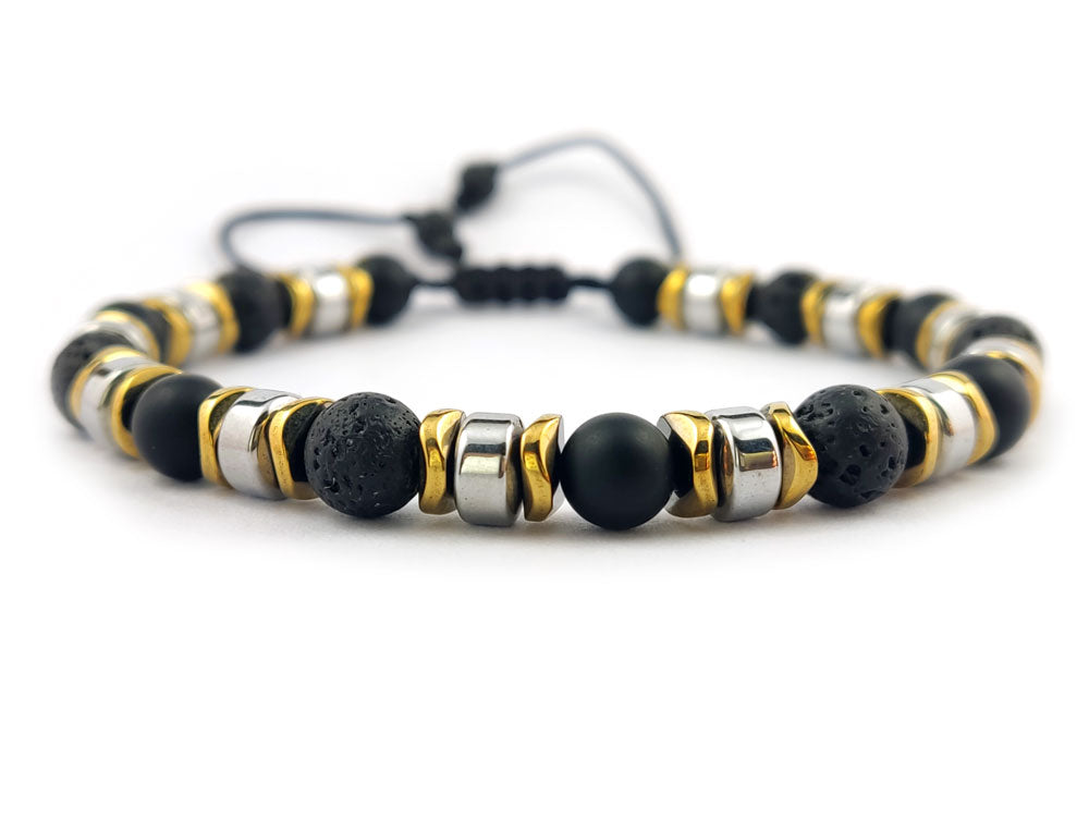 Stylish wrist shot of the bracelet, highlighting its elegant blend of black lava stones and shimmering hematite beads, designed for both men and women.
