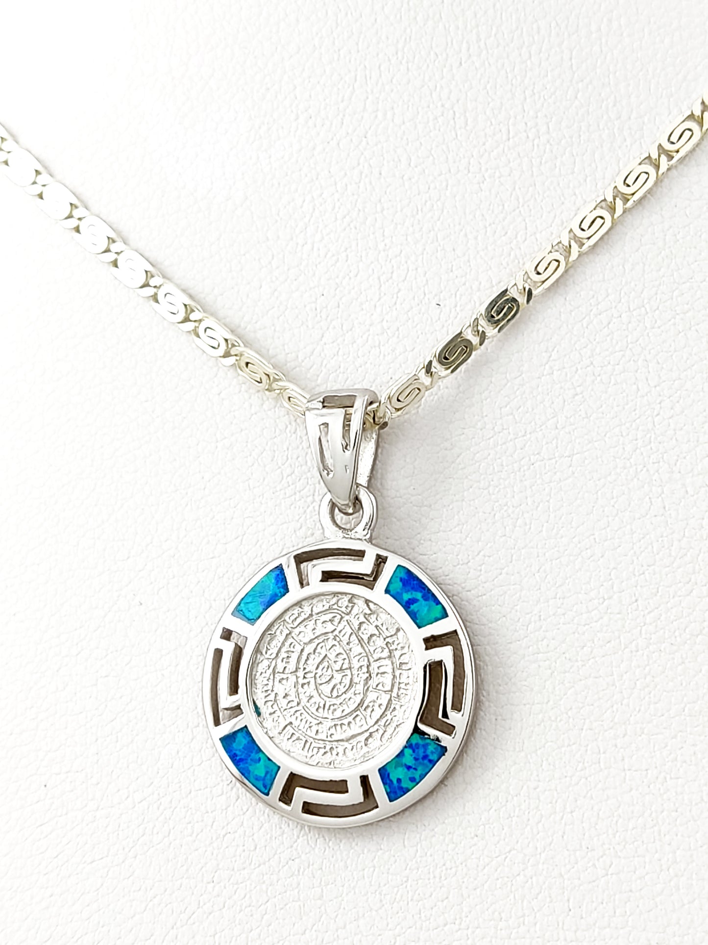 Silver necklace from Greece with the Phaistos Disc pendant together with blue opal stones.