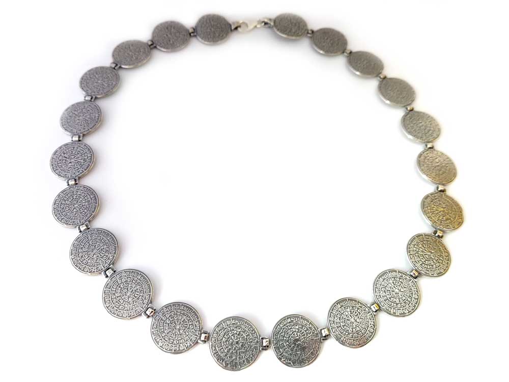 Close-up image of a Sterling Silver 925 Necklace featuring an intricately designed Ancient Greek Minoan Phaistos Disc pendant, symbolizing timeless elegance and heritage craftsmanship.