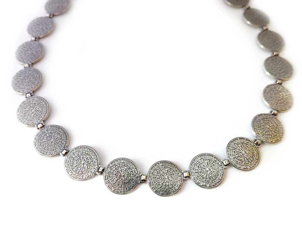 An elegant Sterling Silver 925 Necklace showcasing a stunning Ancient Greek Minoan Phaistos Disc pendant, reflecting the timeless beauty and historical significance of Greek silver jewelry.
