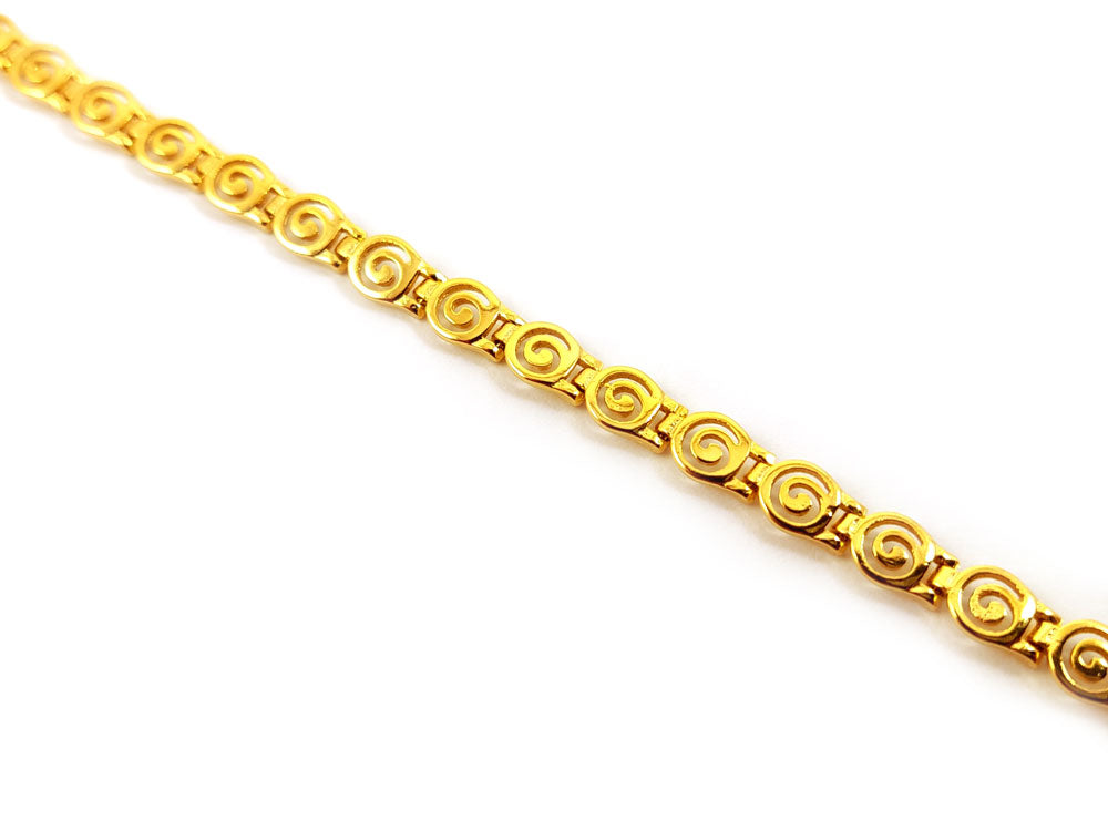 "Close-up of handcrafted Greek spiral infinity design necklace in sterling silver"