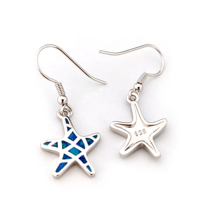 Starfish-shaped silver and opal earrings on a white background