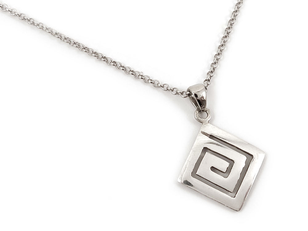 Greek Key Design Pendant in Sterling Silver 925 – A square sterling silver pendant with a Greek Key Meander motif, measuring 16 x 16 mm (0.62 x 0.62 inches). The pendant hangs from a 2 mm (0.007 inch) sterling silver chain. Made in Greece and stamped with hallmark 925, this piece ships worldwide for free.
Greek Key Design Pendant in Sterling Silver 925 – A square sterling silver pendant with a Greek Key Meander motif, measuring 16 x 16 mm (0.62 x 0.62 inches). The pendant hangs from a 2 mm (0.007 inch)