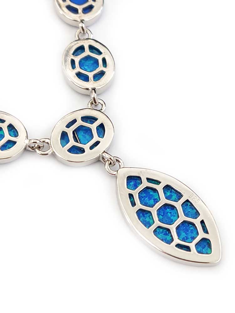 Close-up of hallmarked 925 silver and oval opal stones in necklace