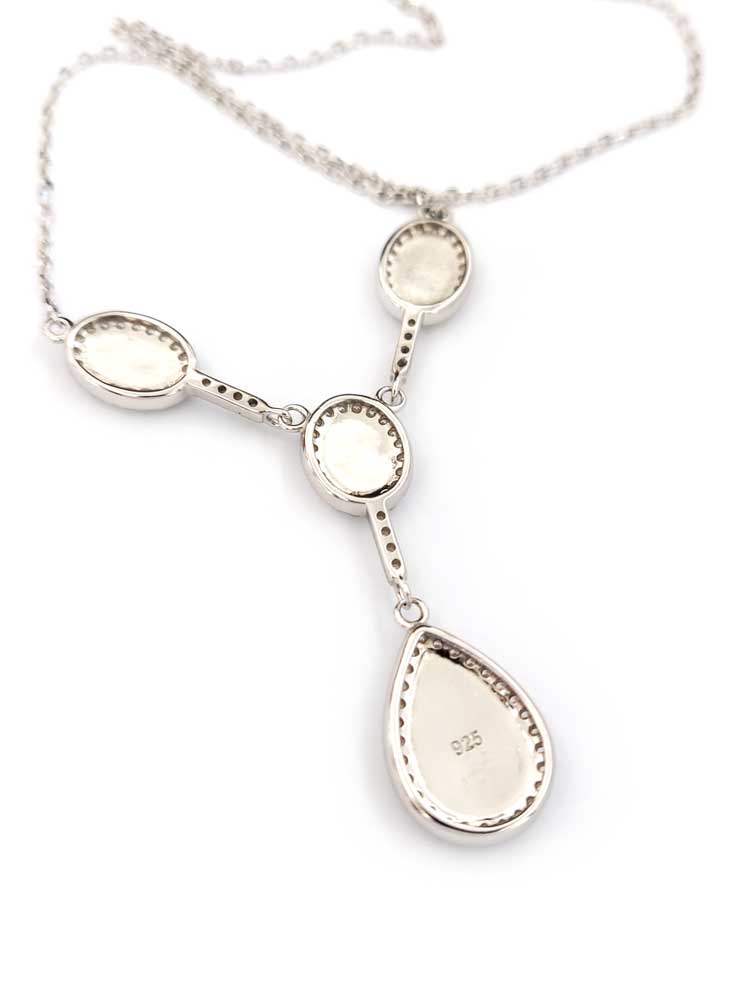 Close-up of hallmarked 925 silver and drop-shaped center pendant