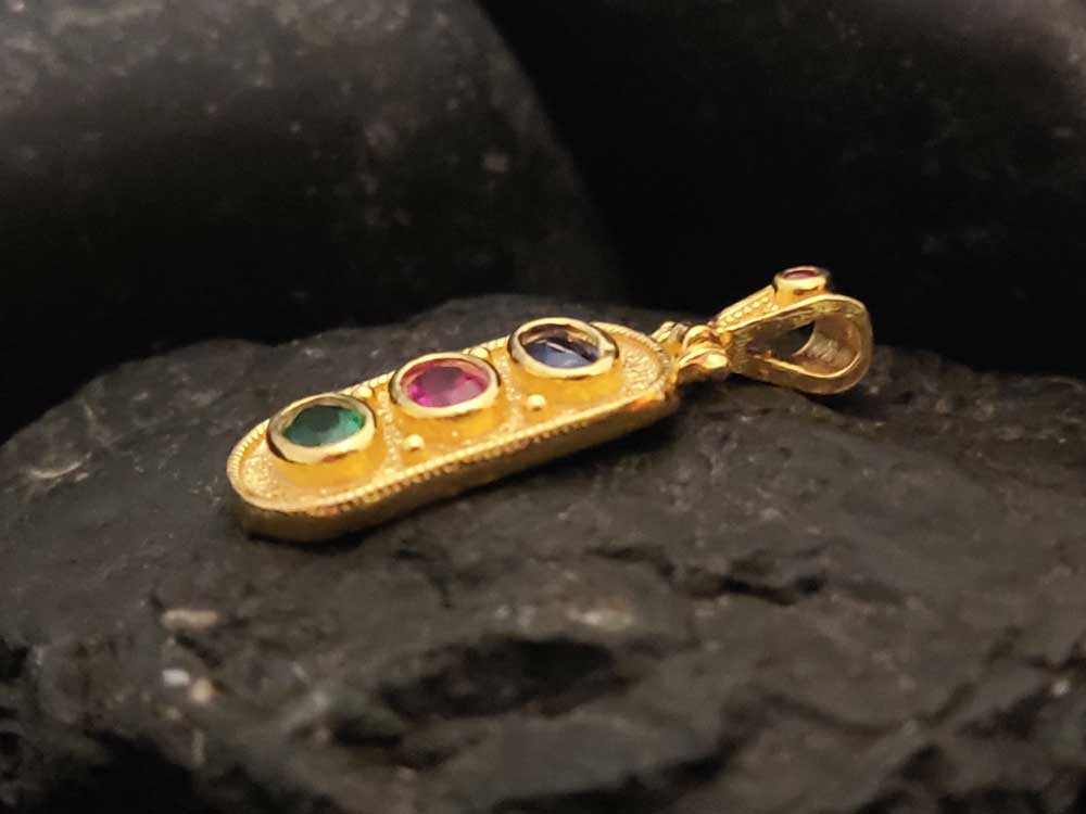 "Elegant rectangular pendant in sterling silver 925 with hallmarked craftsmanship and vibrant gemstones."
