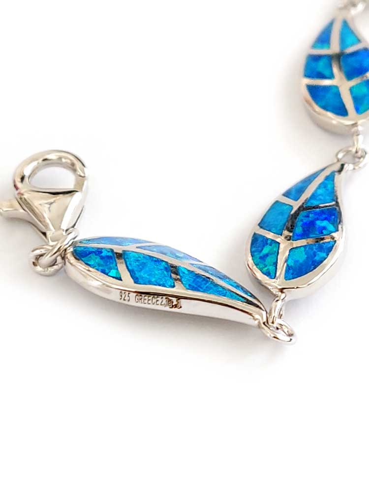 Close-up of hallmarked 925 silver leaf pattern and opal inlay