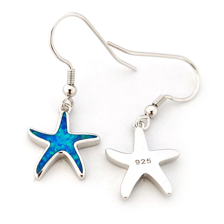 Starfish-shaped earrings on a white background