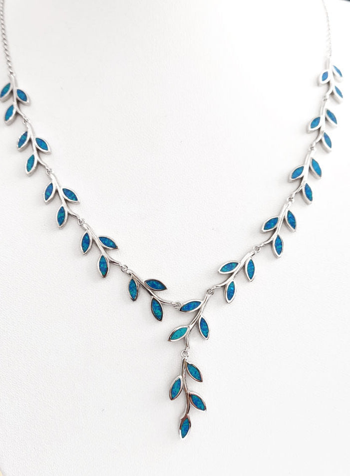 Elegant women’s silver necklace with blue opal leaf design artisan jewelry