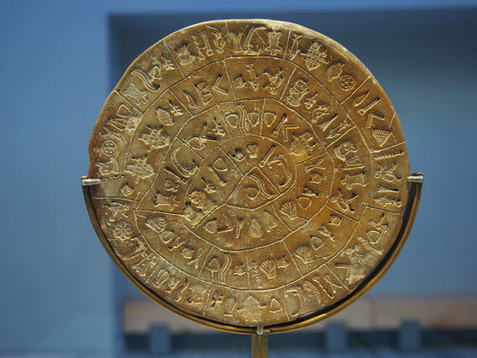 Phaistos Disc exhibited at the Museum in Crete, a 3,600-year-old archaeological artifact.
