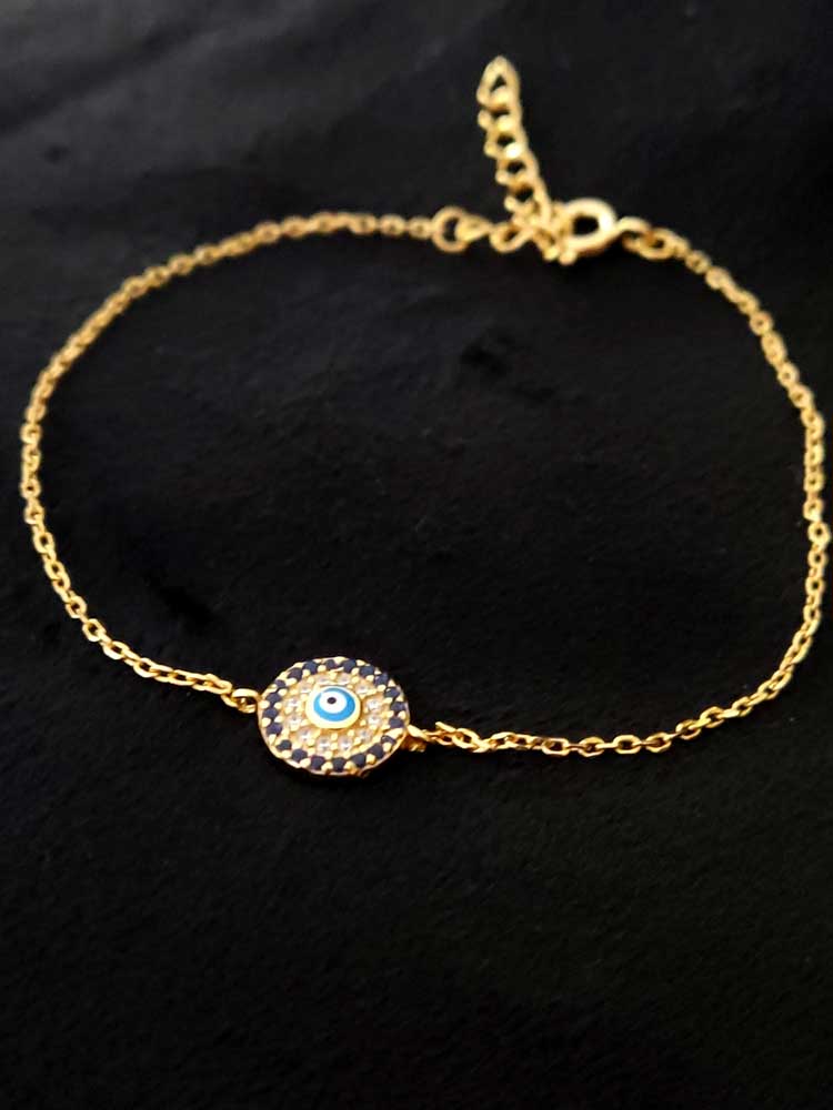 Elegant Greek Evil Eye bracelet in sterling silver 925 with gold plating and sparkling dark blue crystals, handmade in Greece.