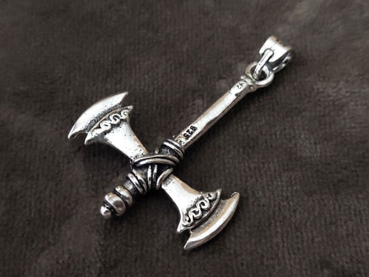 Greek Double Axe Labrys Silver Pendant, 40x27mm, showcasing intricate Minoan design on a gray background.