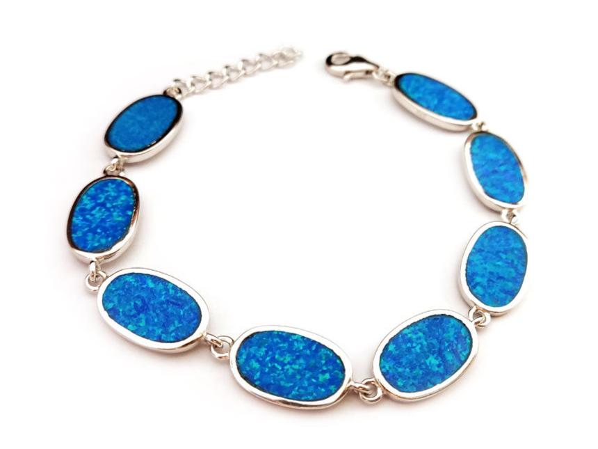 "Close-up of a Blue Opal Greek Silver Bracelet with oval-shaped opal stones and adjustable sterling silver chain."
