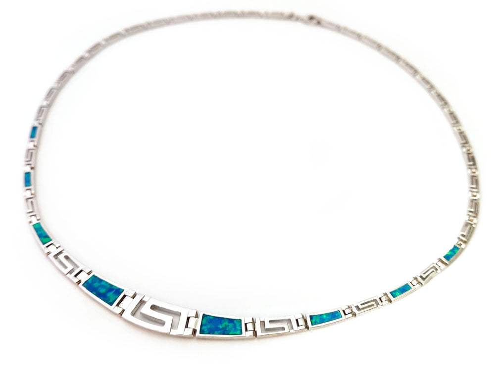 Greek Key silver necklace with blue opal stones that follows a gradual design and has an adjustable length. Width from 4-8 mm and made in Greece.