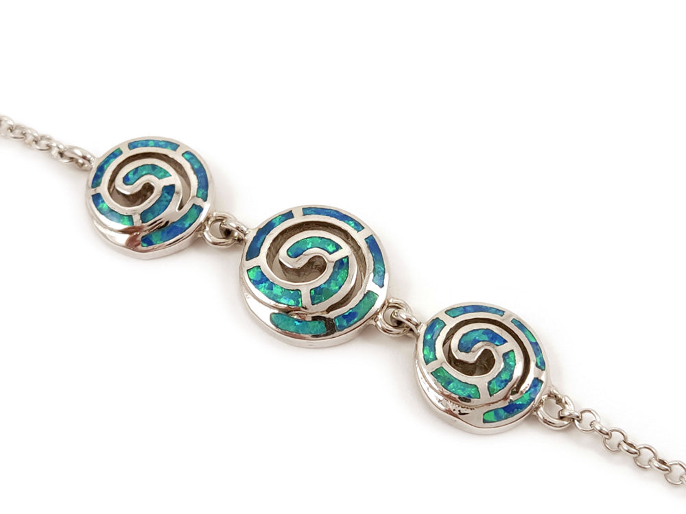 Elegant sterling silver 925 bracelet showcasing blue opal stones and a detailed Greek spiral infinity design. Adjustable chain length of 17 - 20 cm (6.63 - 7.80 inches), with a 2 mm (0.07 inch) wide silver chain. Handmade in Greece, available with free worldwide shipping.