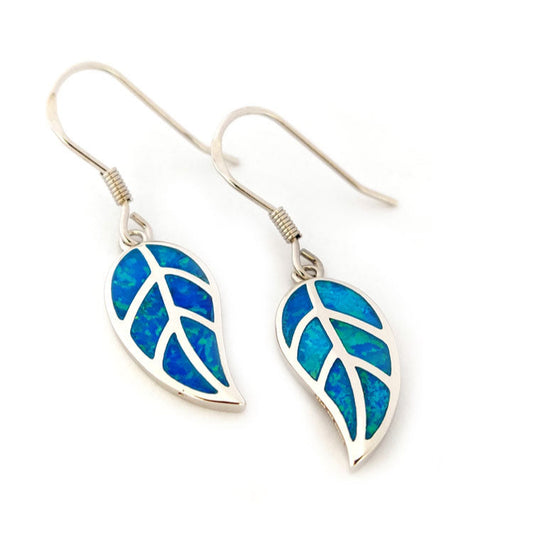 Pair of leaf-shaped silver earrings with blue opal inlay on a white background