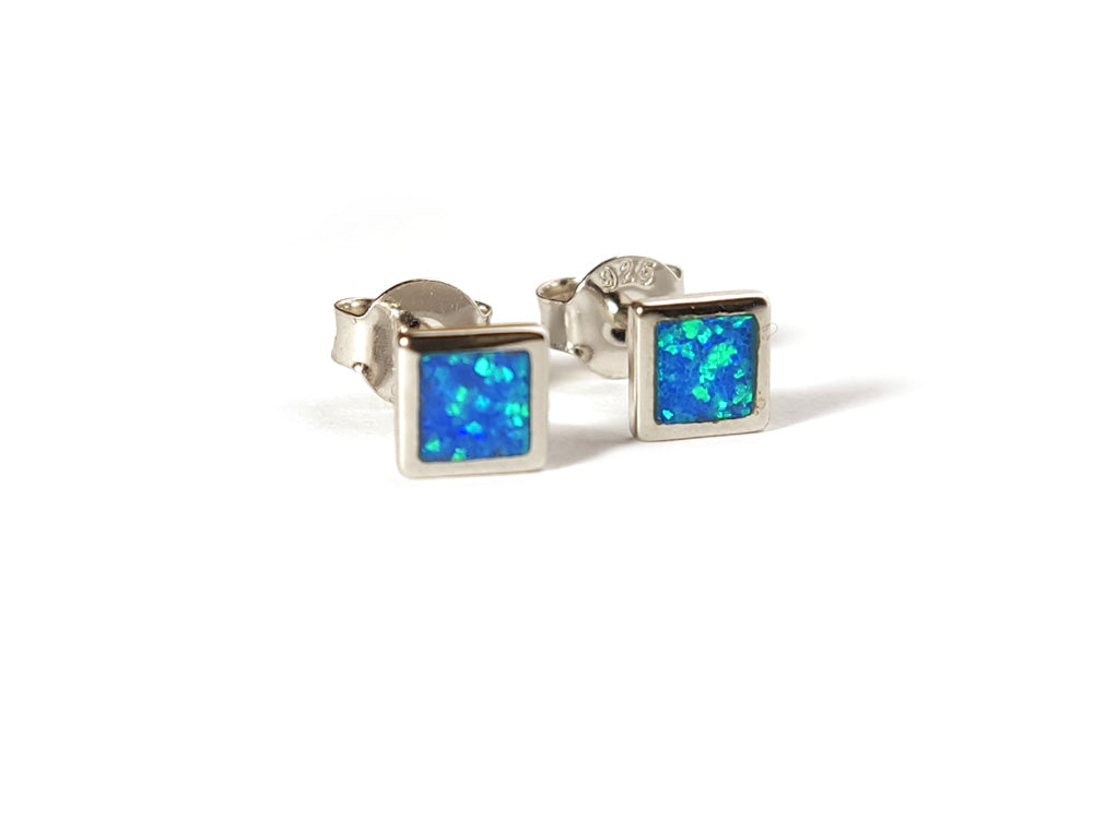 blue opal silver small earrings square shape placed on white background.