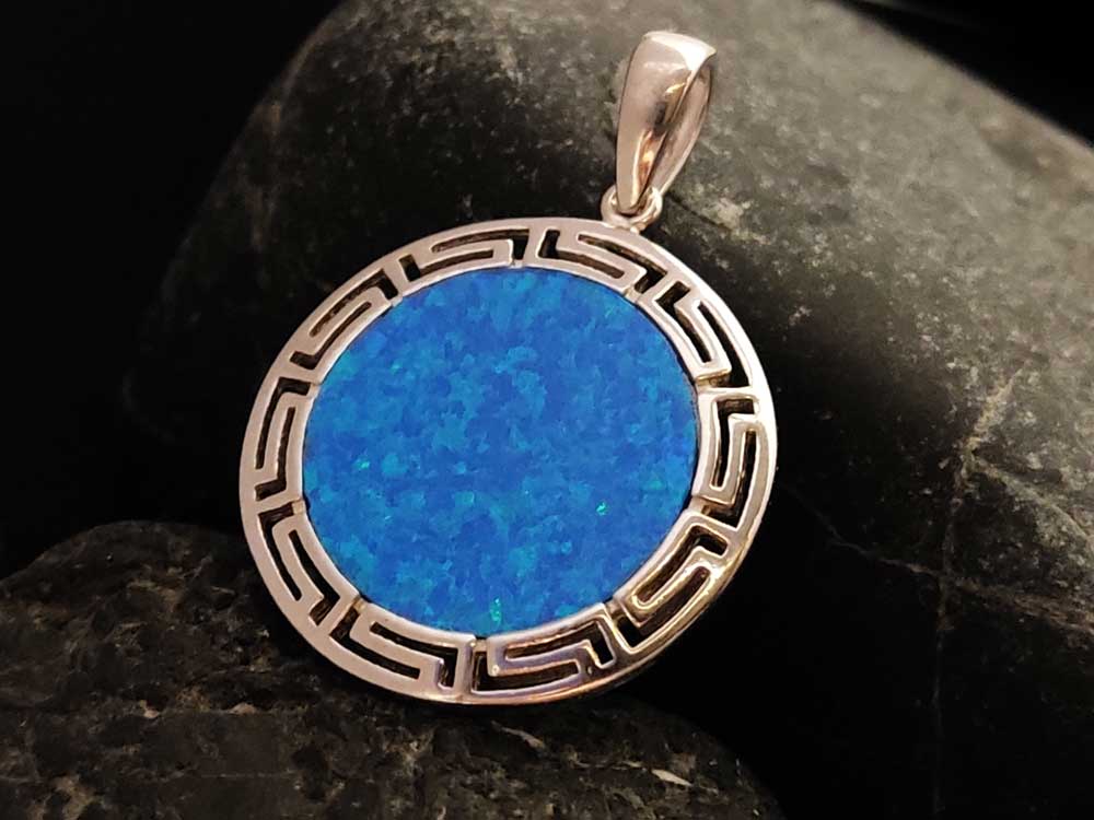 "Handcrafted Greek Key pendant in Sterling Silver 925 with a 2.4 mm Blue Opal stone."
