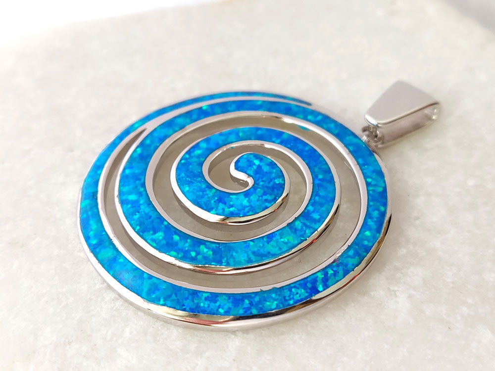 Hallmarked 925 sterling silver Greek spiral blue opal pendant close up