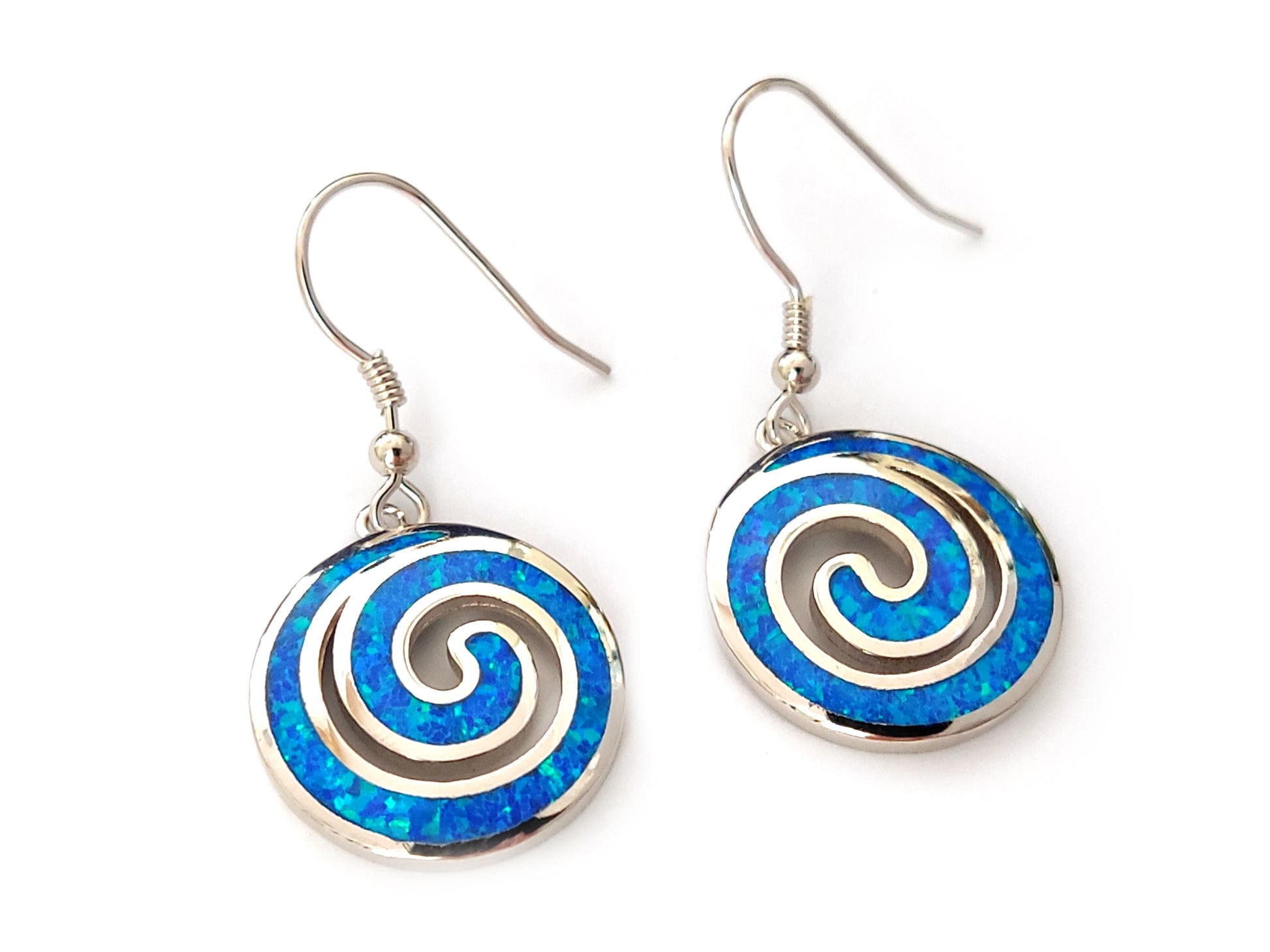Greek silver earrings with spiral design and blue opal stones measuring 18mm diameter on white background.