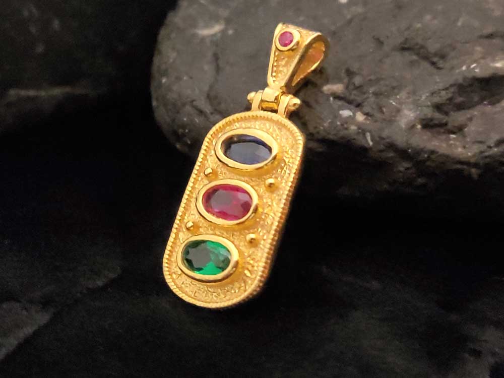 "Handmade sterling silver 925 pendant with gold plating and vibrant cubic zirconia gemstones, crafted in Greece."
