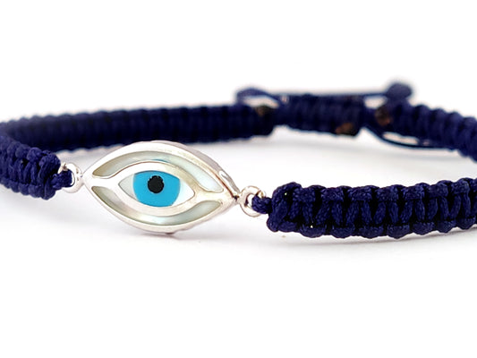 Handmade Greek macrame bracelet with silver evil eye and blue cord.