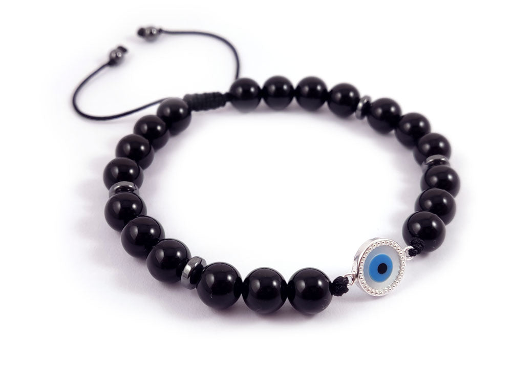 "Sophisticated Sterling Silver 925 bracelet showcasing a 10mm Mother of Pearl Evil Eye charm and natural 8mm onyx black stones. Adjustable with a slide clasp, handmade in Greece, and includes free worldwide delivery."

