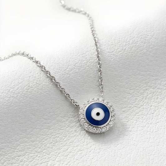 Necklace with a blue evil eye pendant on a white background