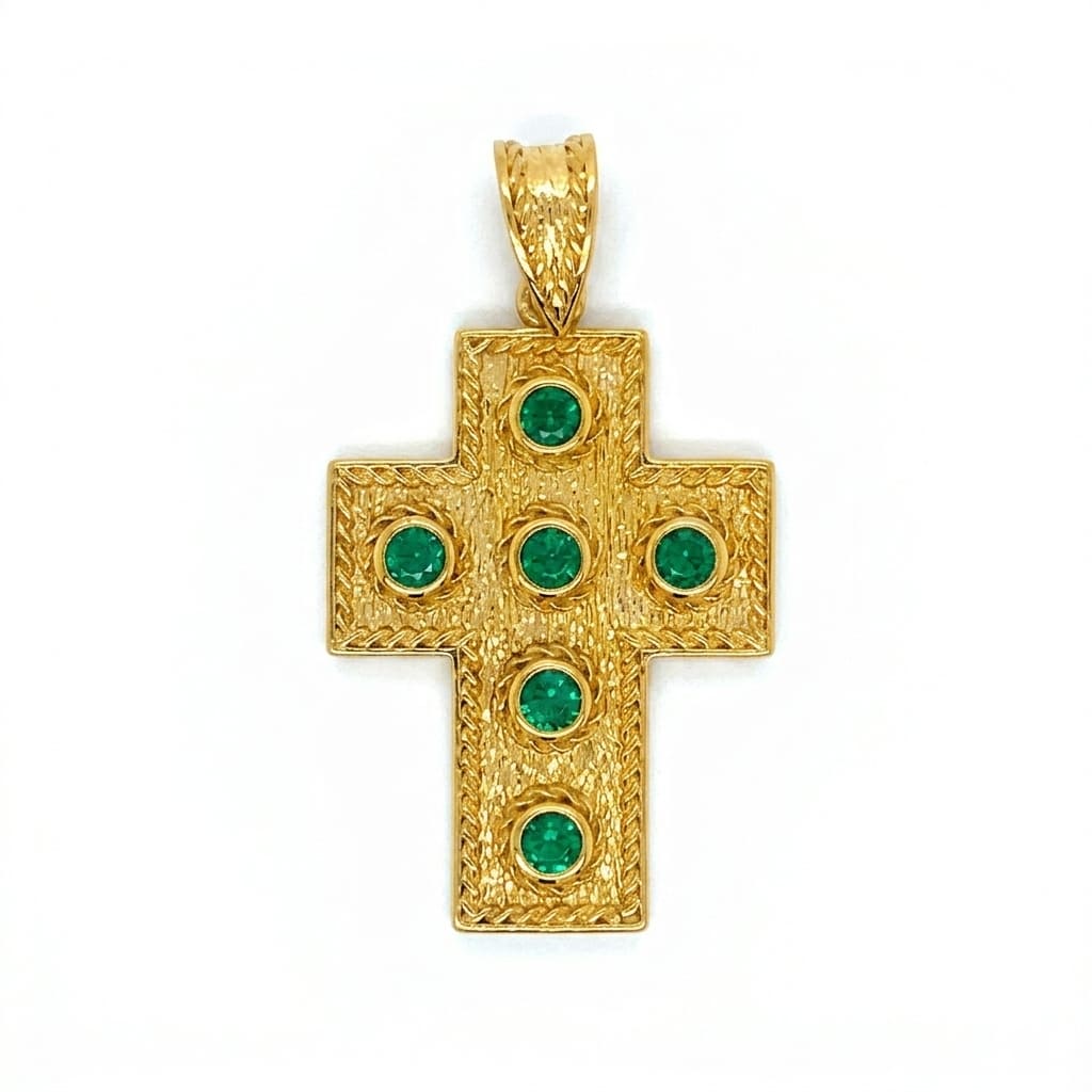 Greek silver goldplated cross pendant with green gemstones on a white background