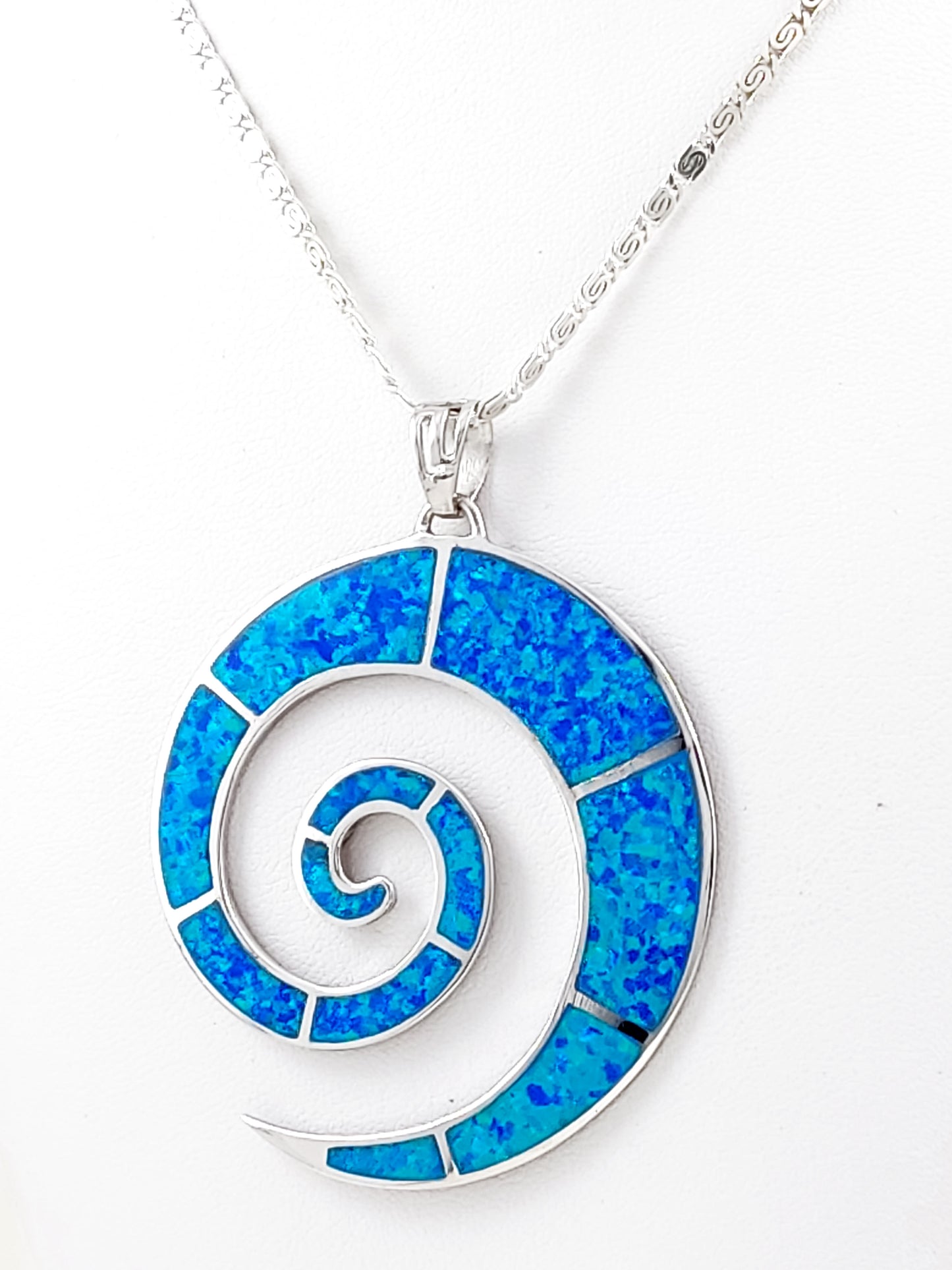 Greek blue opal big spiral necklace from Greece. The blue opal spiral pendant measures 50mm in diameter and the infinity silver chain measures 2mm in width.