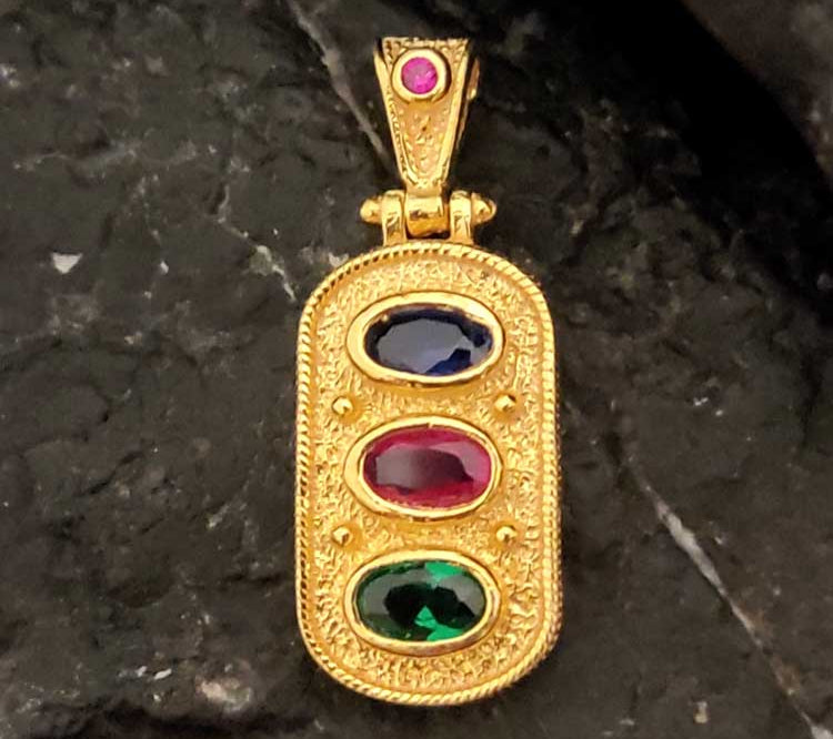 "Greek Byzantine rectangular pendant in sterling silver 925 with gold plating and red, green, and blue cubic zirconia."
